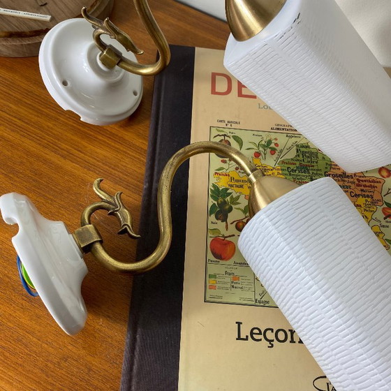 Image 1 of Pair of brass gooseneck wall lights with white glass and porcelain mounting rosettes