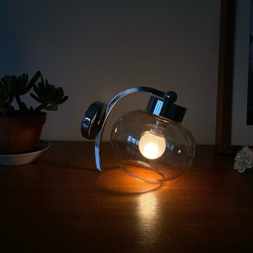Wall light in chromed metal and smoked grey glass globe