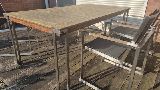 Image 1 of Set da giardino con tavolo in teak e 4 sedie in acciaio inox, realizzato in teak e textilene.