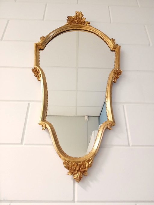 Vintage mirror with gold leaf decoration
