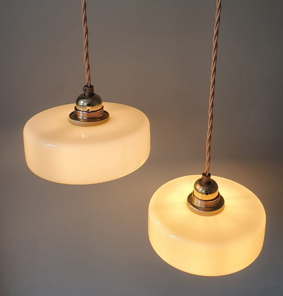 Image 1 of Vintage pendant lamp set (2) of yellow pastel opaline glass. Art Deco design.