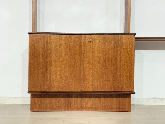 Modular mid-century wall shelf by interna-Peter Pedrides / Teak shelving system 1960s – Shelving unit, Wood (photo 19 of 27)