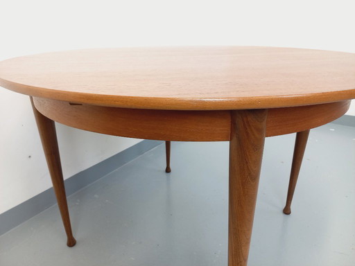 Vintage Scandinavian style round teak dining table from the 1950s/60s with extension