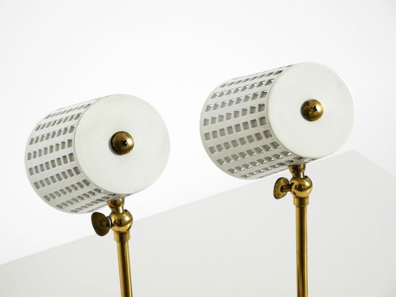 Image 1 of A pair of beautiful mid-century modern bedside lamps with perforated metal shades and teak wood bases