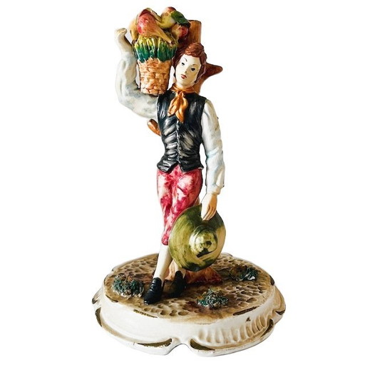 Vintage mid-century Italian Bassano sculpture of a young man with fruit, 1950s, signed