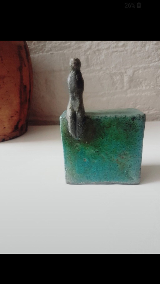 A moment of silence,ceramic figurine
