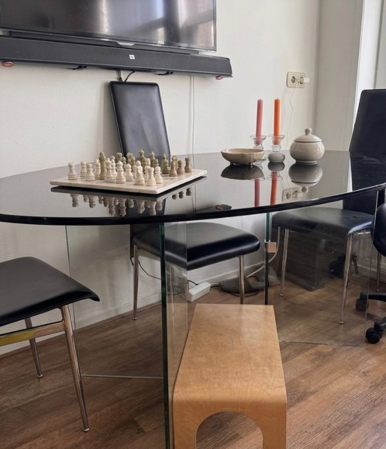 Image 1 of Oval smoked glass dining table