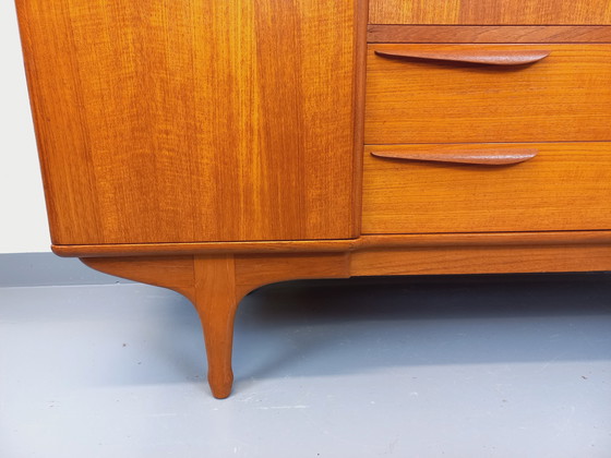 Image 1 of Scandinavische vintage kledingkast in teakhout uit de jaren 60 van ontwerpers Tricoire en Vecchione voor "Meubles TV Paris".