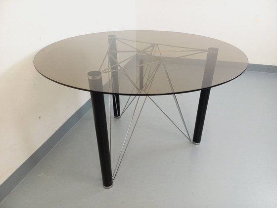 Image 1 of Vintage round dining table in smoked glass, black metal and chrome metal from the 80s