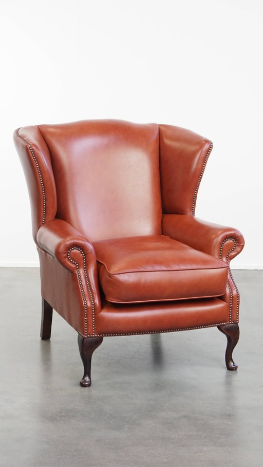 Comfortabele Engelse chesterfield oorfauteuil van rundleer