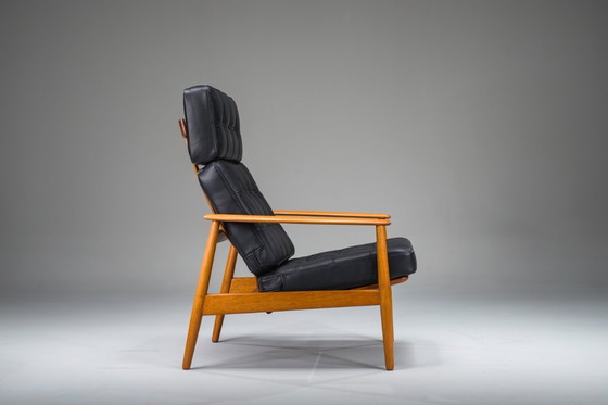 Image 1 of Fauteuil met model FD 164 frame van Arne Vodders en model 118 armleuningen van Grete Jalks in teak en zwart leer, Denemarken, ja