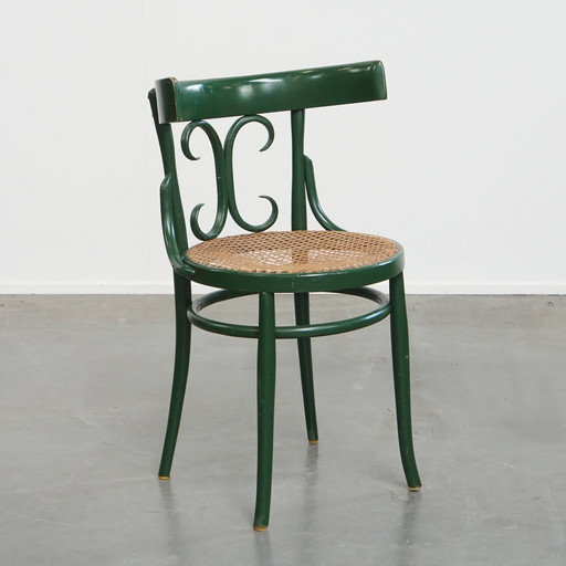 Green Vintage Bistro Chair With A Matted Wicker Seat