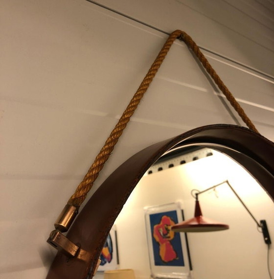 Image 1 of https://www.1stdibs.com/furniture/mirrors/wall-mirrors/pizzetti-cognac-leather-mirror-1950s-italy/id-f_33697732/