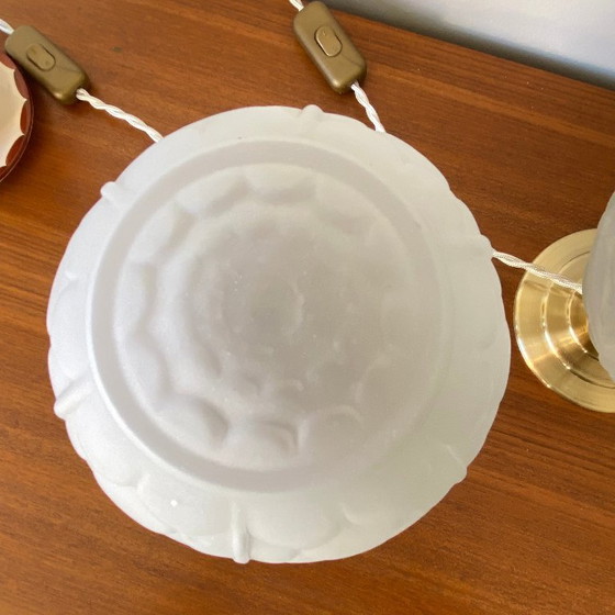 Image 1 of Pair of vintage bedside lamps with antique glass globes and brass bases, circa 1950