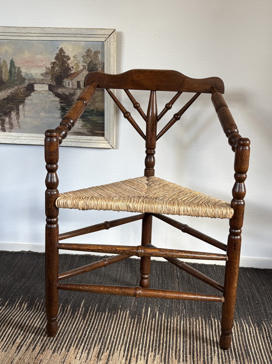 Image 1 of  Vintage Antiek 20ste eeuw eiken hoekstoel met biezen zitting h85cm