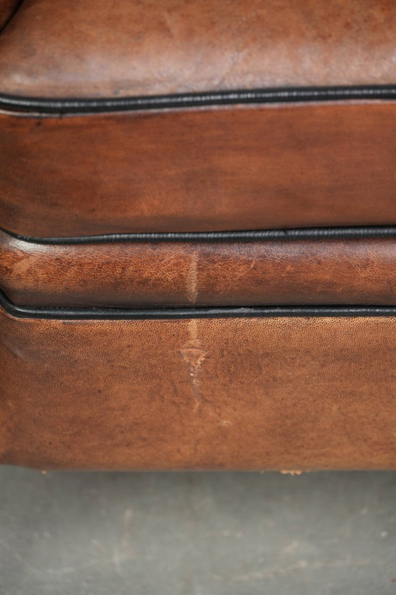Image 1 of 2x schapenleren Art Deco design clubfauteuil met een mooi patina, zwarte biezen en mooie kleuren