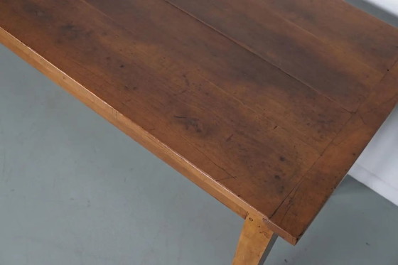 Image 1 of Antiker französischer rustikaler Bauernhaus-Esstisch aus Kirschholz aus dem frühen 20. Jahrhundert