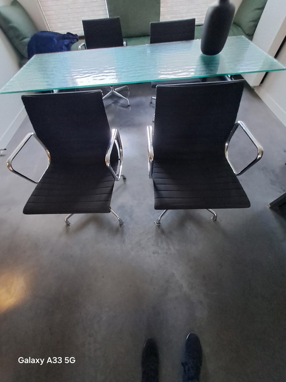Image 1 of Beautiful combination of Cassina Le Corbusier table with frosted glass and 4 Vitra Eames chairs with black hupsakee upholstery 