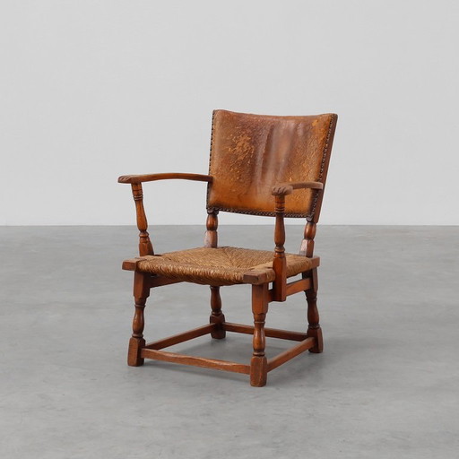 Sillón de cuero y roble de Theo Ruth para Artifort, Países Bajos Años 40