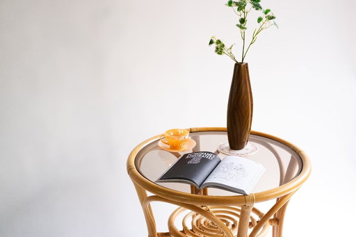 Elegant, round bamboo table with glass top