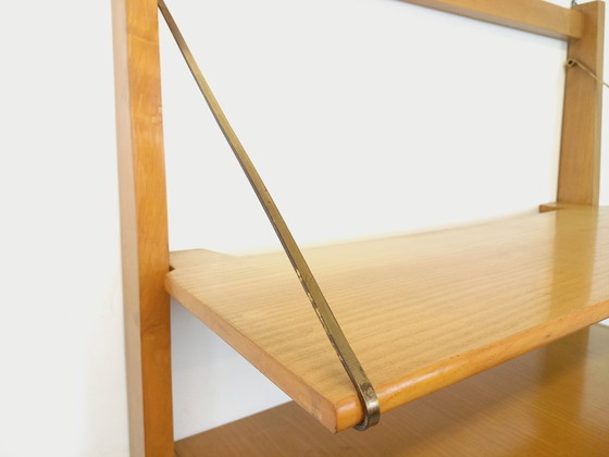 Image 1 of Wall-mounted bookcase with vintage light wood and brass secretary bar, dating from the 1960s