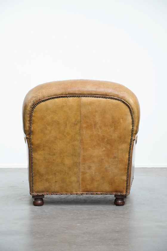 Image 1 of Vintage generfde rundleren fauteuil met ronde vormen