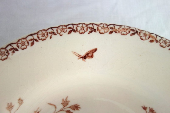 Image 1 of 11 assiettes creuses Terre De Fer Gien modèle Mai vers 1900
