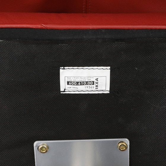Image 1 of IKEA red leather armchair designed by K. Hagberg – M. Hagberg, from 2000–2010, with a tubular steel tripod base