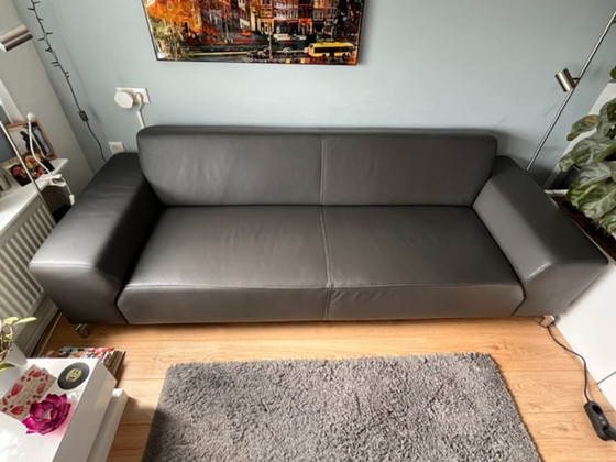 Image 1 of Bellissimo divano di design a 3 posti in pelle grigio/antracite + pouf abbinato.