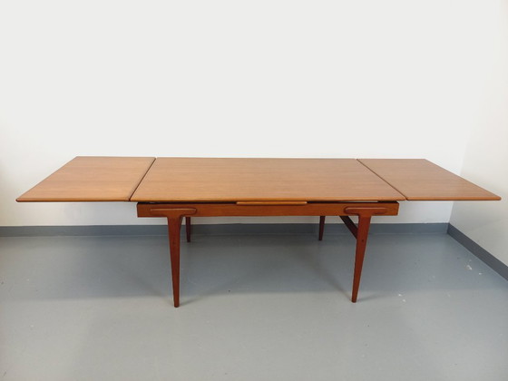 Image 1 of Vintage Scandinavian rectangular dining table by Ejvind A. Johansson from the 50s and 60s in teak with integrated extensions