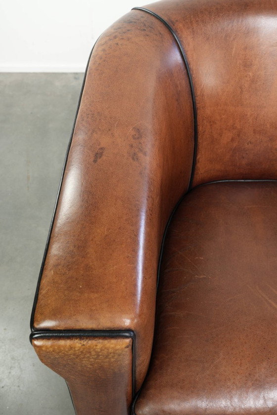 Image 1 of 2x schapenleren Art Deco design clubfauteuil met een mooi patina, zwarte biezen en mooie kleuren