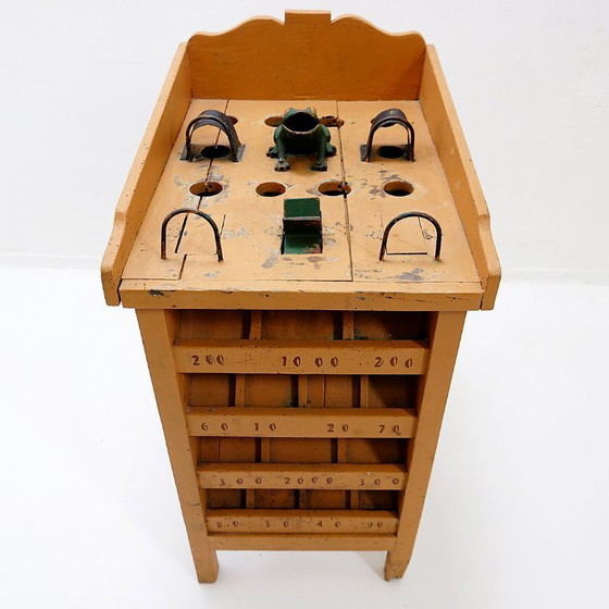 Image 1 of "The Frog Game", an old game made of wood and painted iron, early 20th century