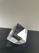 Tilted glass cube with prismatic effect