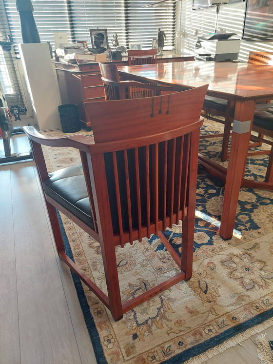 Image 1 of Rectangular long dining table with four luxurious leather-upholstered chairs by Schuitema Stadskanaal. In very good condition.