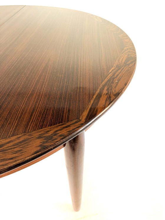 Image 1 of Vintage Rosewood extendable dining table '60