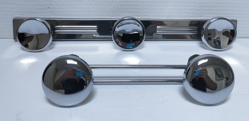 two vintage chrome-plated metal coat hooks