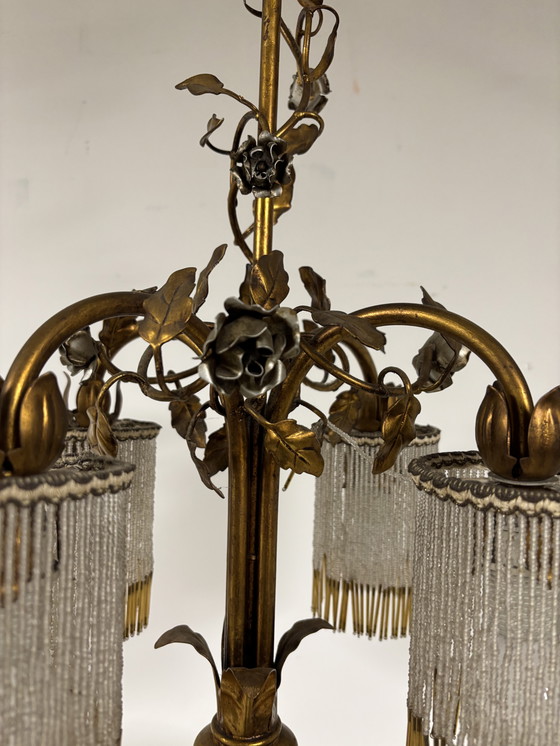 Image 1 of Exclusive chandelier with brass leaves and silver-colored roses