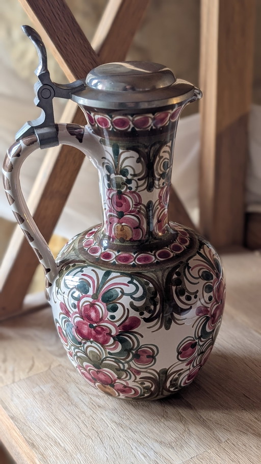 Antique hand-painted earthenware pitcher

Red and green floral decoration - signed ASM 0375