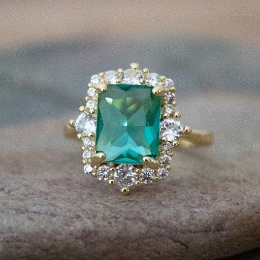 Ring with Emerald Green Glass Cabochon and Rhinestones