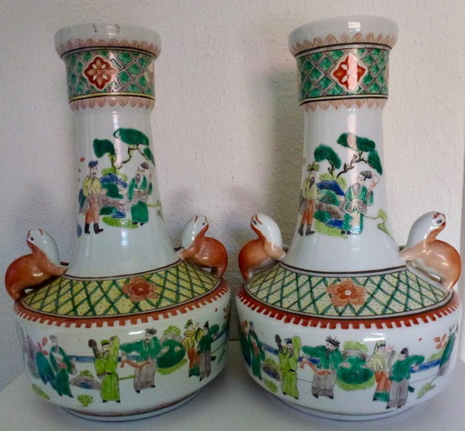 2x Old porcelain Chinese vases with handle in the shape of a squirrel.