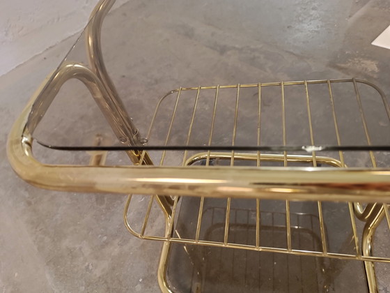 Image 1 of Vintage gold coloured and glass trolley side table 