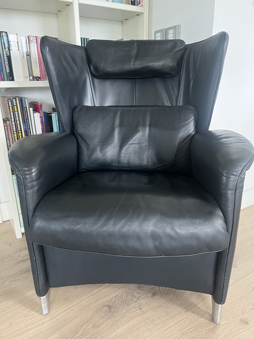 DeSede DS23 black leather designer ear armchair with footstool.
