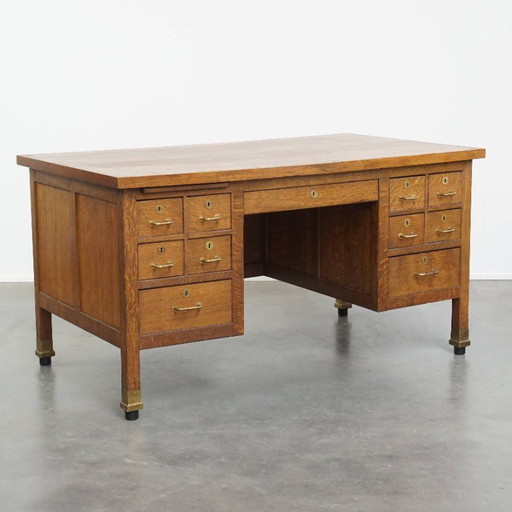 Antique Art Deco desk from early 20th century made of oak in Amsterdam school style