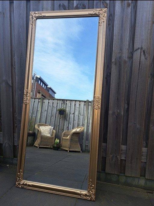 Grote spiegel antieklook goudbrons met facet