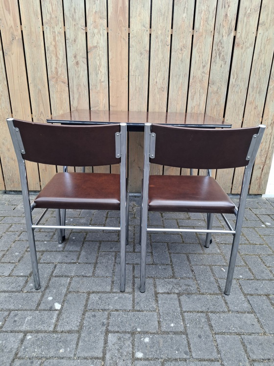 Image 1 of Vintage kitchen table with 2 chairs. 1960s