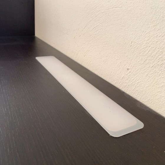 Image 1 of Sleek wall unit with hanging element ALPE