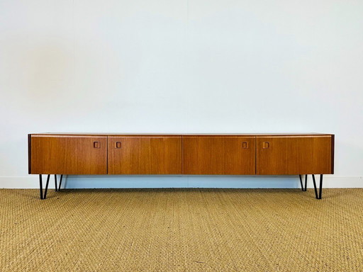 Low Scandinavian teak sideboard with metal compass legs, 1960