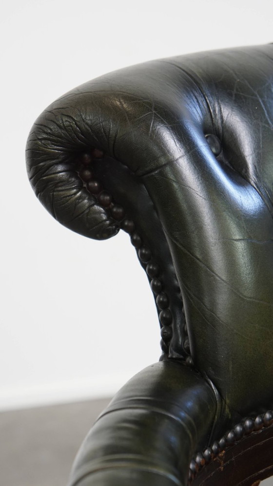 Image 1 of Dark green cowhide leather and wood height-adjustable, swivel and tilt Chesterfield office chair