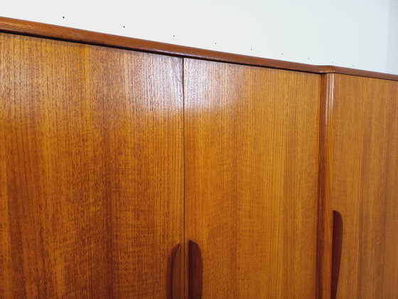 Image 1 of Scandinavische vintage kledingkast in teakhout uit de jaren 60 van ontwerpers Tricoire en Vecchione voor "Meubles TV Paris".