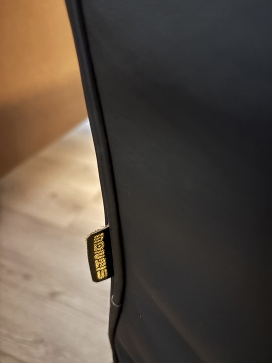 Image 1 of 6 zwarte Montis Chaplin stoelen met rvs onderstel